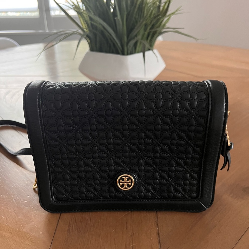 Tory Burch black leather flap purse.